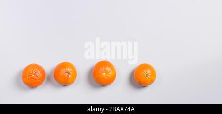 Three Fresh Oranges on Grey Background Stock Photo