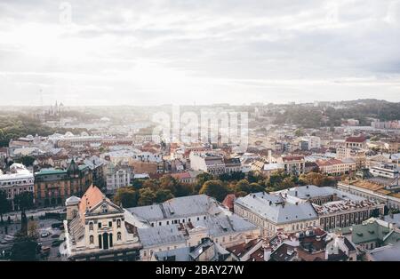 Up view of old town in europe. Daylight and sunlight above in sky. Amazing beautiful view. Lviv in Ukraine. Stock Photo