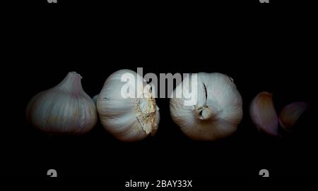 detail of a set of garlic on a dark background Stock Photo