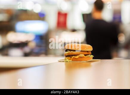 cheeseburger on the table. fast food restaurants. Stock Photo