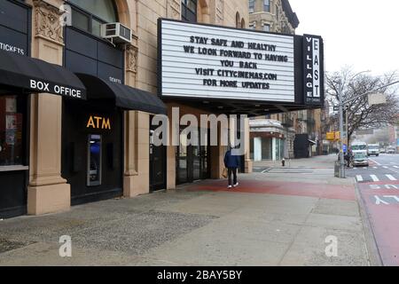 New York, NY, 29th March 2020. Empty streets, and a closed movie theater in the East Village neighborhood of Manhattan with a 'Stay Safe and Healthy' message on its marquee during the coronavirus COVID-19 pandemic. Credit: Robert K. Chin. Stock Photo