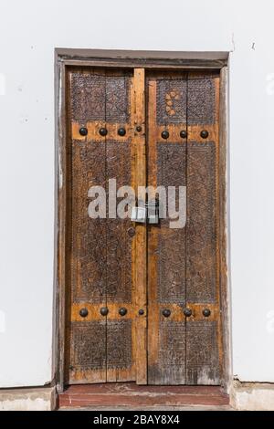 Old door near Toqi Telpakfurushon, in the city center, Bukhara, Buchara, Uzbekistan, Central Asia, Asia Stock Photo