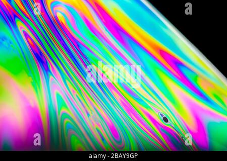 Macro of a soap bubble with abstract rainbow colors Stock Photo