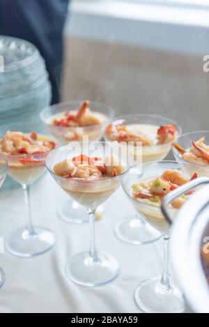Vertical closeup shot of fancy shrimp dishes in cocktail glasses Stock Photo