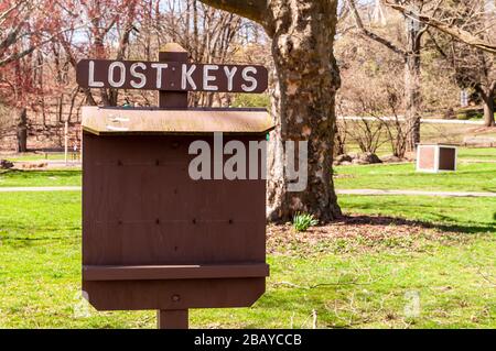 A Lost Keys wooden board in Frick Park on a sunny winter day, Pittsburgh, Pennsylvania, USA Stock Photo