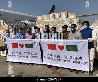 Dhaka. 30th Mar, 2020. Donated medical supplies from the Jack Ma Foundation and the Alibaba Foundation arrive at Hazrat Shahjalal International Airport in Dhaka, Bangladesh, on March 29, 2020. The Jack Ma Foundation and the Alibaba Foundation, with the coordination and help of the Chinese Embassy in Dhaka on Sunday donated medical supplies to the Bangladeshi Ministry of Health and Family Welfare to assist the Bangladeshi government in containing the COVID-19 spread. The donated medical supplies includes 30,000 COVID-19 testing reagents and 300,000 masks. Credit: Xinhua/Alamy Live News Stock Photo