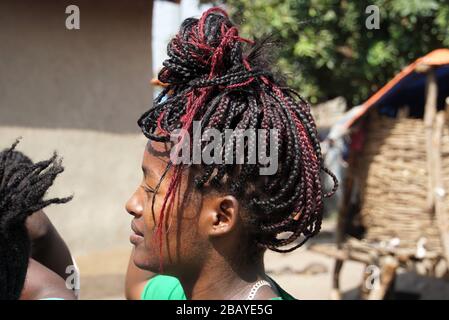 Close Up Profile of a young modern Ari Woman with elaborate Braids Stock Photo