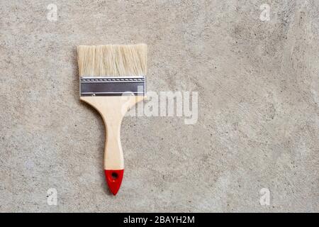 Paint brush on cement floor background. copy space Stock Photo