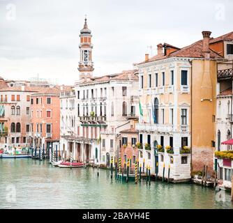 Picturesque Cityscape of Venice. Old Buildings on Grand Canal. Italy. Cloudy Sky. Tower of Church of the Holy Apostles of Christ. View from Rialto Bri Stock Photo