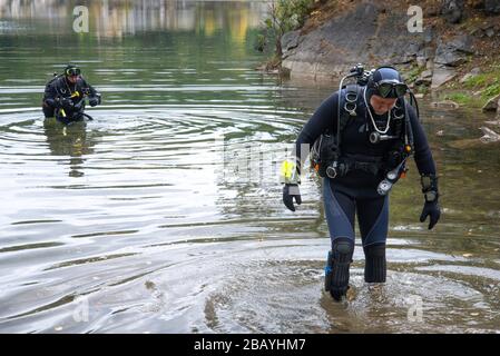 Lake Paayanne, Finland - September 2019. Divers enter the lake. Fully equipped divers, scuba divers Stock Photo