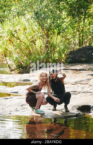 Smiling stylish mature couple taking selfie by the river Stock Photo