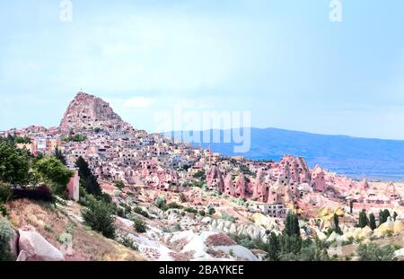 Carved houses in multi-colored rocks in Pigeon Valley, Uchisar, Cappadocia, Turkey