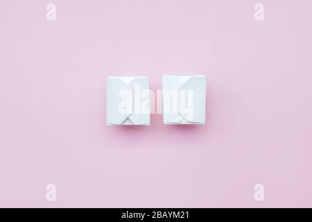two paper boxes white take-away food on pink background white paper box with clipping path Stock Photo