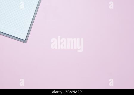 Single simple empty white notebook with a blank for drawing or writing, on pink background Top view. Mock up. Flat lay Stock Photo