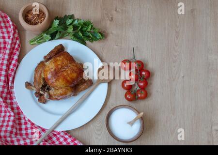 Directly above shot of roasted chicken and vegetables on table Stock Photo