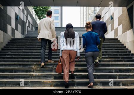 Business people walking up the stairs when going to work in the morning Stock Photo