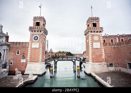 Venice. Italy - May 13, 2019: The Main Gate at the Venetian Arsenal (Arsenale di Venezia). View from Ponte del Paradiso. Canal Rio dell Arsenale. Stock Photo