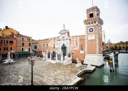 Venice. Italy - May 13, 2019: The Main Gate at the Venetian Arsenal (Arsenale di Venezia). View from Ponte del Paradiso. Canal Rio dell Arsenale. Stock Photo