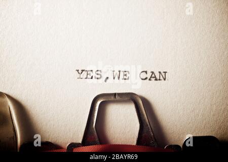 The sentence, Yes we can, written with a typewriter. Stock Photo