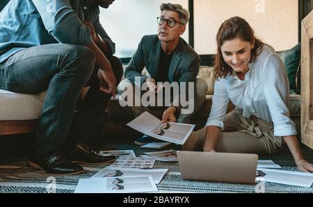 Team of creative people discussing about new project. Diverse group of people having a meeting in the office. Stock Photo