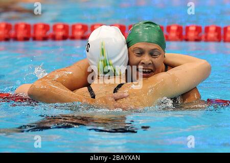 Australia's Ellie Cole (left) is congratulated by South Africa's Natalie du Toit (right) after winning the Women's 100m Freestyle - S9 Stock Photo