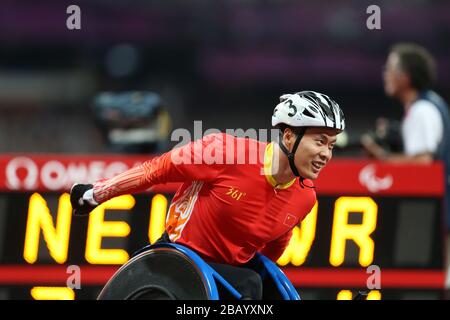 China's Lixin Zhang crosses the line to win Gold in the Men's 4 x 400m Relay - T53/54 in a new world record time at the Olympic Stadium, London Stock Photo