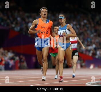 Italy's Annalisa Minetti with guide Andrea Giocondi during the Women's 1500m - T12 Final at the Olympic Stadium, London Stock Photo