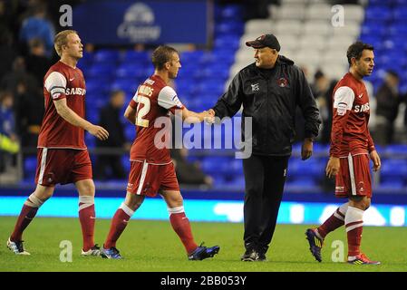 Leyton Orient manager Russell Slade (right) with Martin Rowlands (left) after the final whistle Stock Photo