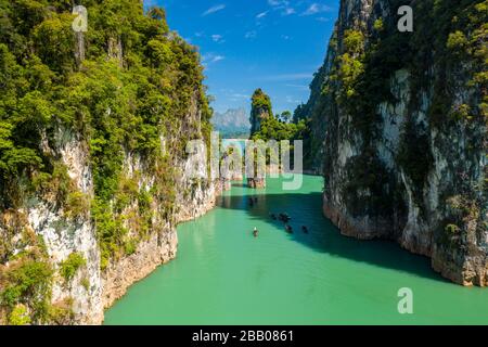 Low altitude aerial view of limestone karsts,covered in jungle sticking out of a huge lake (Cheow Lan Lake) Stock Photo