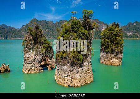 Low altitude aerial view of limestone karsts,covered in jungle sticking out of a huge lake (Cheow Lan Lake) Stock Photo