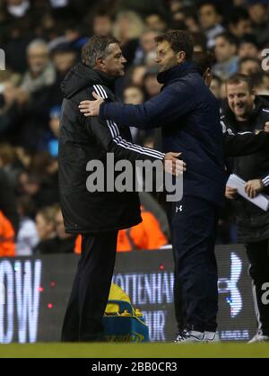 Tottenham Hotspur interim manager Tim Sherwood (right) is commiserated with by West Ham United manager Sam Allardyce at the end of the match Stock Photo