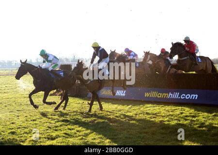 Jockey Tom Cannon on Brandon Thomas (left) and Jonathan England on Shouldavboughtgold during the William Hill - Download The App Novices' Handicap Chase Stock Photo