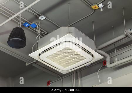 Ceiling mounted cassette type air conditioner. Stock Photo