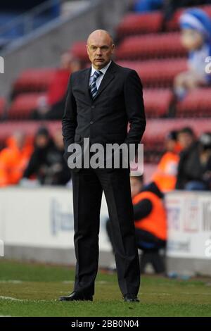 Wigan Athletic's Manager Uwe Rosler puts an arm around Nick Powell ...