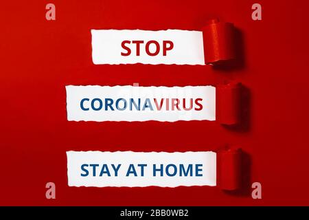 Words on red craft paper. Stop coronavirus layout. Stay at home. Outbreak of coronavirus concept. Novel virus - COVID-19-nCoV. Stock Photo