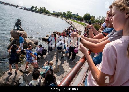 Tourists looking at The Little Mermaid statue in Copenhagen, Denmark, Europe Stock Photo