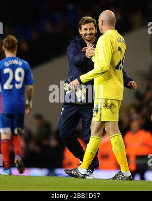 Tottenham Hotspur's manager Andre Villas-Boas congratulates goalkeeper Brad Friedel after his save won the penalty shoot out Stock Photo