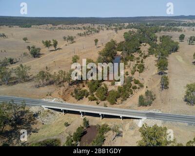 Aerial of the concrete traffic bridge over the head waters of the Burnett River during a drought Stock Photo