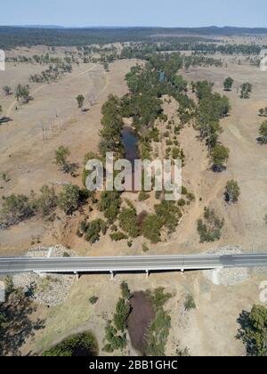 Aerial of the concrete traffic bridge over the head waters of the Burnett River during a drought Stock Photo