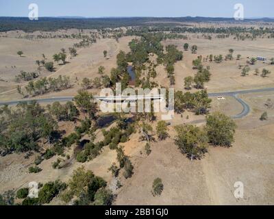 Aerial of the concrete traffic bridge over the head waters of the Burnett River during a drought Stock Photo