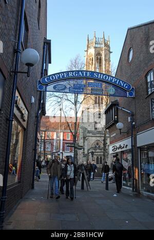 Shoppers in Coppergate Shopping in the city of York in Yorkshire, Britain.   A street name with the ending of Gate, is a Viking word for ‘street’.   I Stock Photo