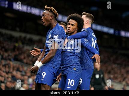 Chelsea's Willian (centre) celebrates scoring his side's first goal of the game with team-mates Tammy Abraham (left) and Mason Mount Stock Photo