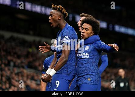 Chelsea's Willian (centre) celebrates scoring his side's first goal of the game with team-mates Tammy Abraham (left) and Mason Mount Stock Photo