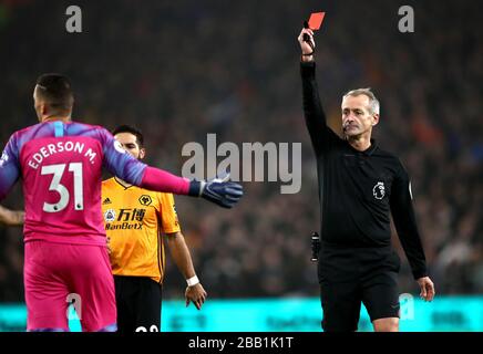Referee Martin Atkinson shows Manchester City goalkeeper Ederson a red card Stock Photo