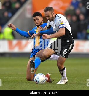 Coventry City's Liam Kelly battles with Shrewsbury Town's Josh Laurent Stock Photo