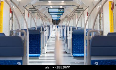 An empty S-Bahn (Munich public transport). Due to the exit restricitons related to Covid-19 the number of people commuting decreased significantly. Stock Photo