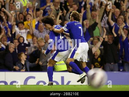 Everton's Marouane Fellaini (left) celebrates with team-mate Nikica Jelavic after scoring his side's first goal of the game Stock Photo