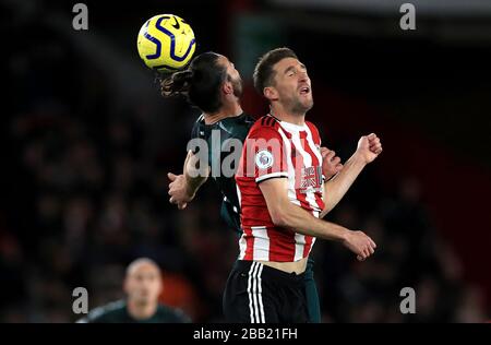 Newcastle United's Andy Carroll (left) and Sheffield United's Chris Basham battle for the ball Stock Photo