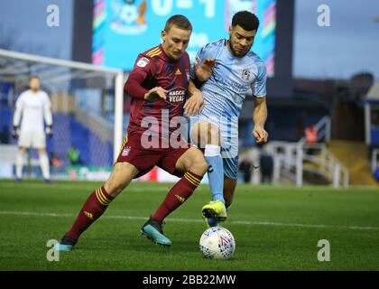 Coventry City's Maxime Biamou (right) and Ipswich Town's Luke Woolfenden during the Sky Bet League One match at St Andrew's Trillion Trophy Stadium Stock Photo