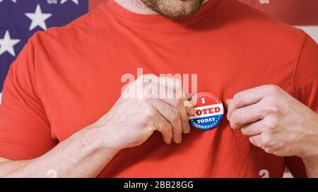 Man putting on I Voted Today button for Presidential election 2020 in America. Stock Photo